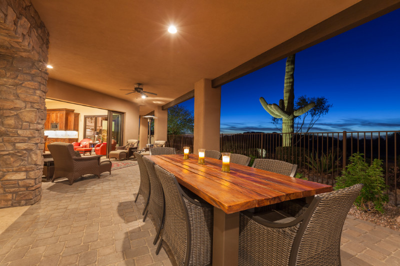 Luxury desert home patio with dining table after sunset