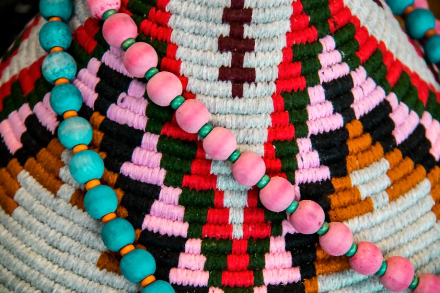 american indian decor background pink and turquoise beads draped