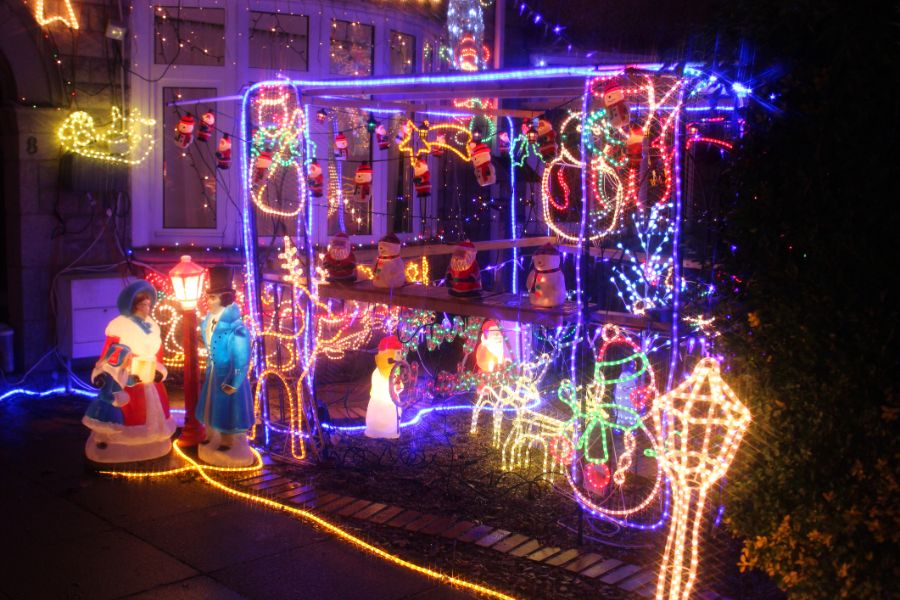 Night time image of house colourful christmas lights decorations